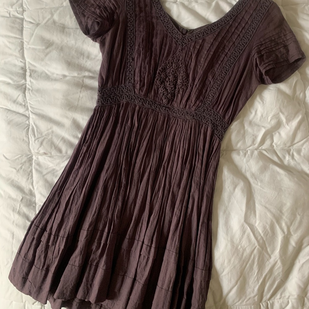 Mauve sundress with detailed handwork.